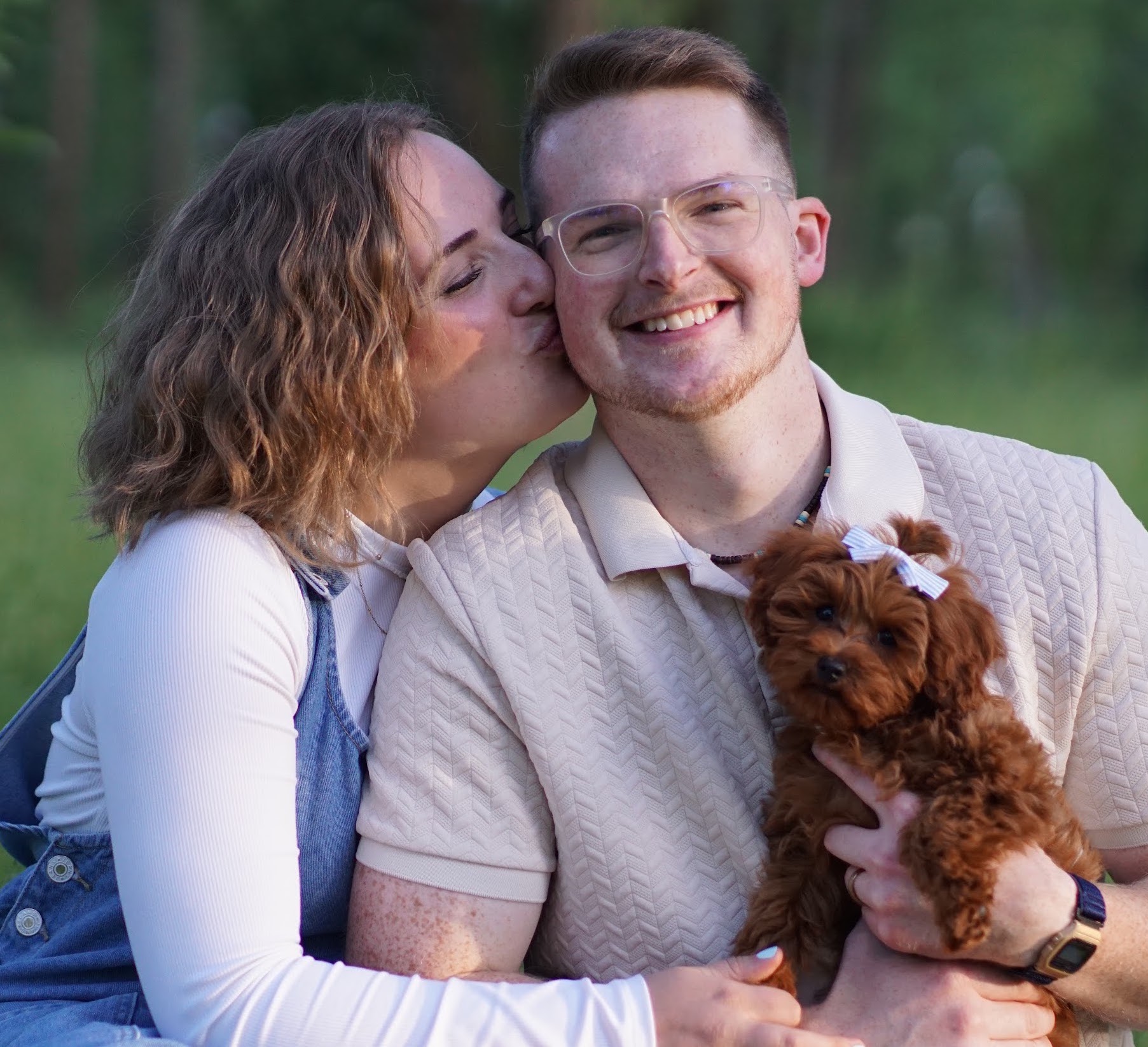 Image of Logan Young and family in a meadow.